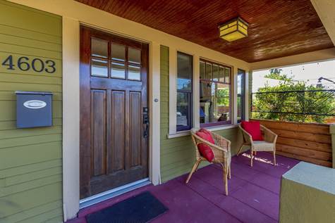 Great front porch, with a newly stained bead board ceiling &  freshly sanded / stained front door. 