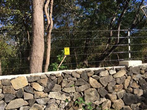 electric fence goes around gated community 