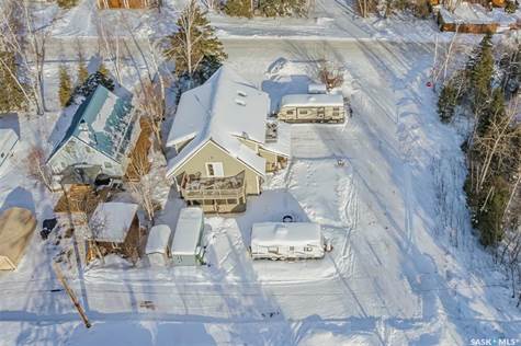 Great overhead view of home on lot. It is a deadend road running beside and behind the home, low traffic.