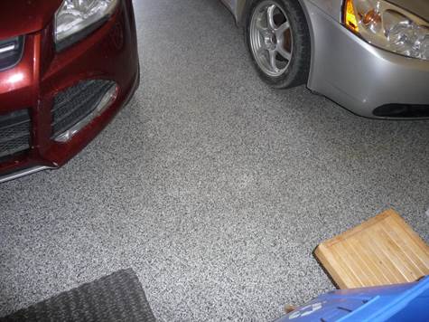 Attractive professionally installed coated garage floor makes cleaning a breeze