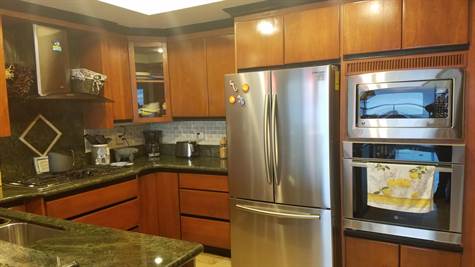 Modern stainless-steel appliances included