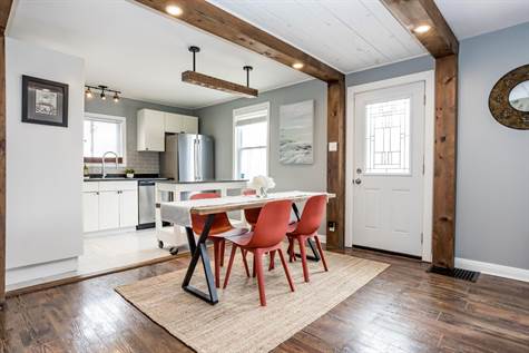 Your Kitchen is open to the Living Room & Dining Room w/Exposed Wood Beam Accents & Pot Lights