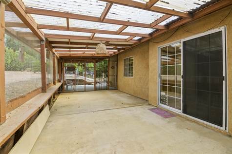 Huge covered patio with security doors on each end