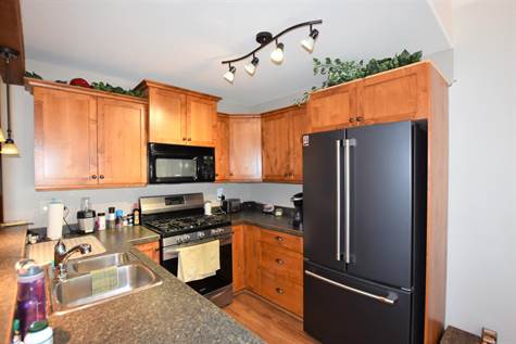 stainless steel appliances including a gas stove 