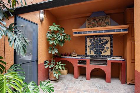 Outdoor grill area with hand-painted tile