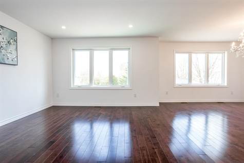 Spacious & Bright Living Room & Dining Room w/Oversized windows w/tons of Natural Light & Pot Lights throughout
