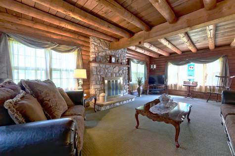 living room with field stone fireplace