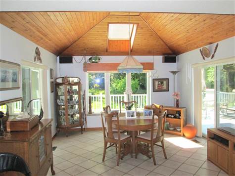 Dining Area w/Vaulted Ceiling & Skylight