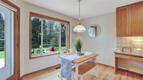 Easy access to the patio via the door to the left, large window to enjoy your private back yard.