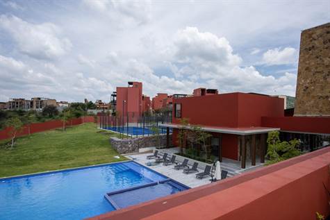 View of the clubhouse pool and courts from roof terrace