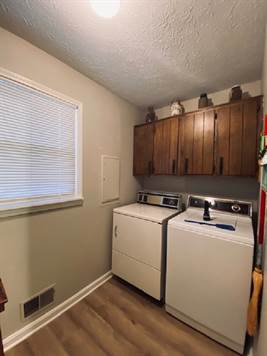 Nice Laundry Room with cabinetry