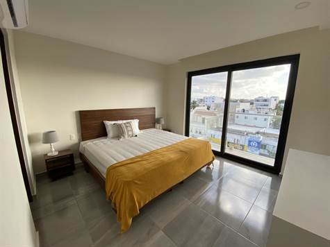 NEW CONDOS FOR SALE IN PLAYA DEL CARMEN CITY CENTER BEDROOM WITH VIEW EXTERIOR