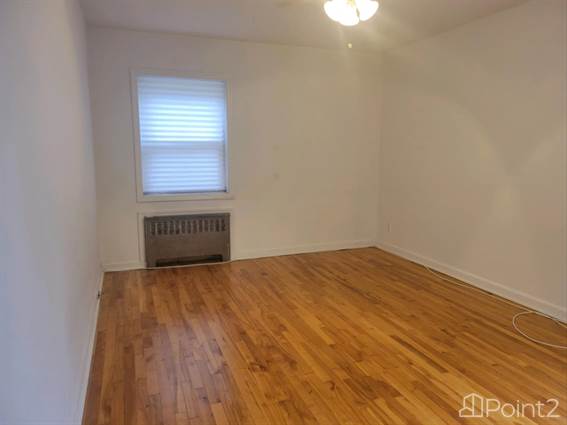 Bedroom view... gleaming hardwood floors throughout this unit... - photo 16 of 25