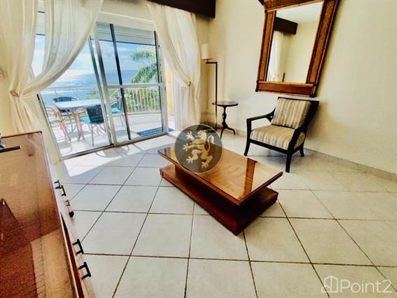 Indulge in the Luxury of Azure and Purple Views with This Condo, Sint Maarten
