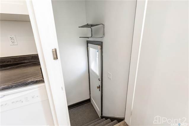 door from kitchen to side entry (suite access)