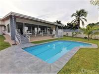 Photo of Beautiful modern home with pool and 0, 63 acres enclosed flat lot in the center of town..